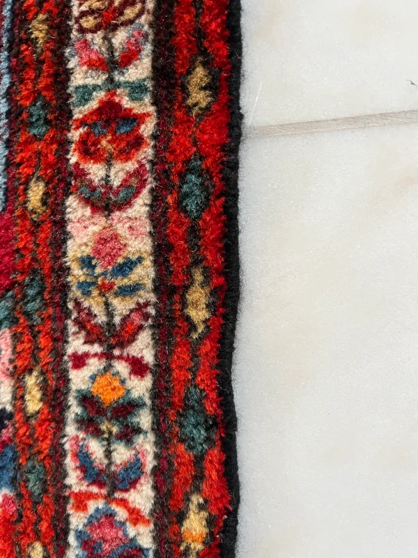 rénovation lisière tapis d'iran après