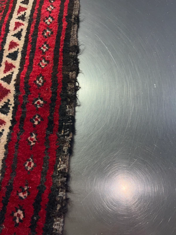 bordure tapis pakistan bokhara abimée