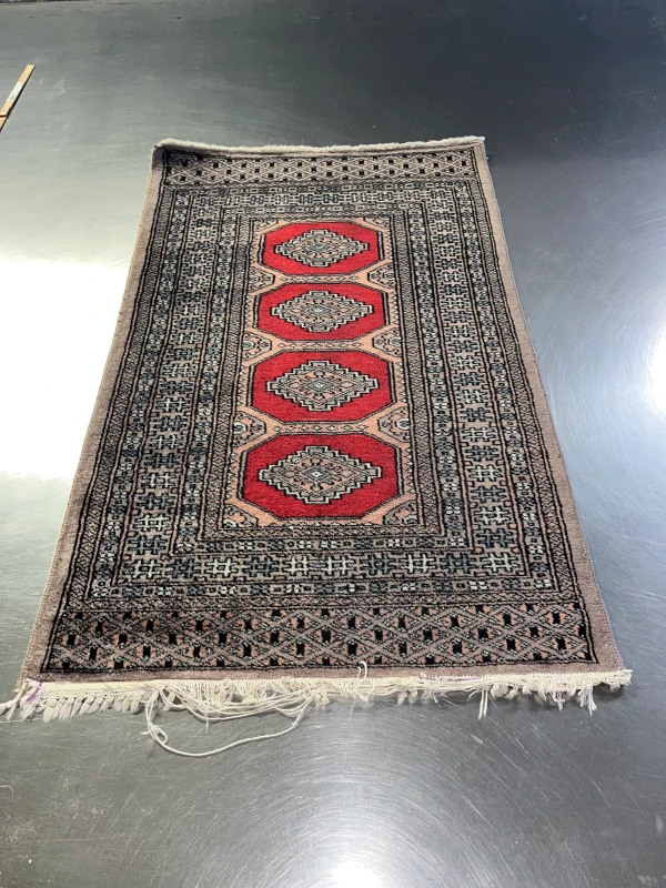 frange tapis pakistan bokhara abimée avant